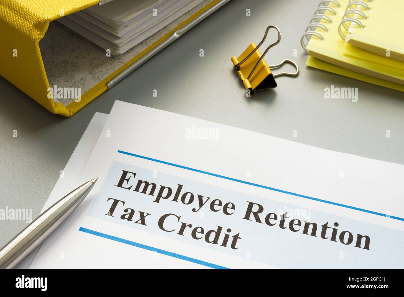Employee retention tax credit papers and folder Stock Photo Alamy