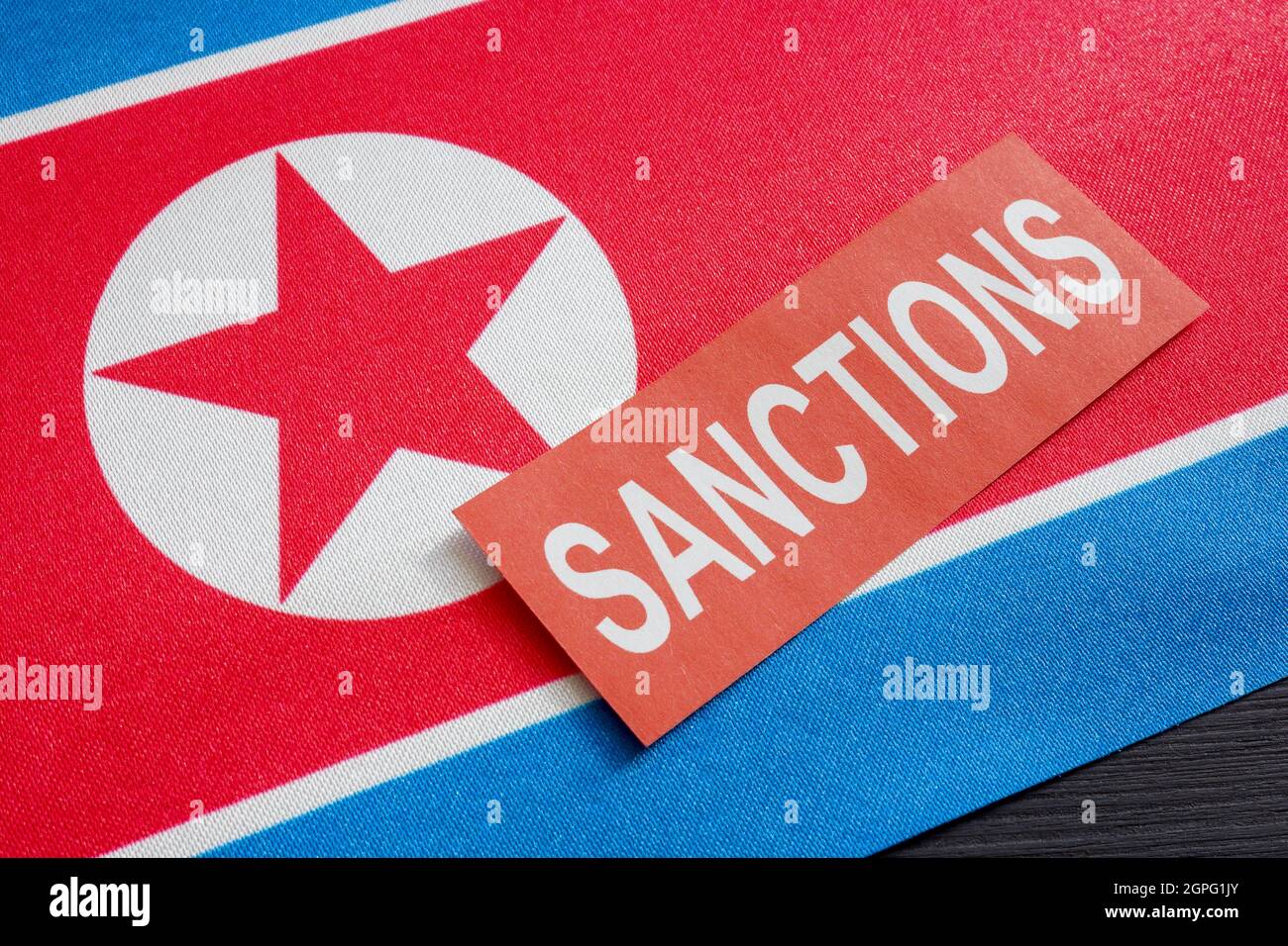 North Korea flag and the word sanctions. Stock Photo