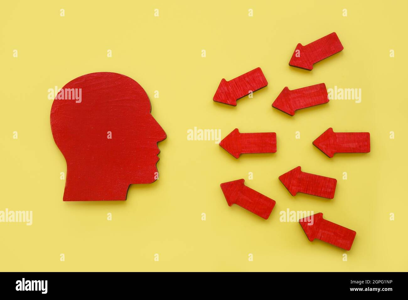 Head shape and arrows. Resilience or emotional pressure concept. Stock Photo