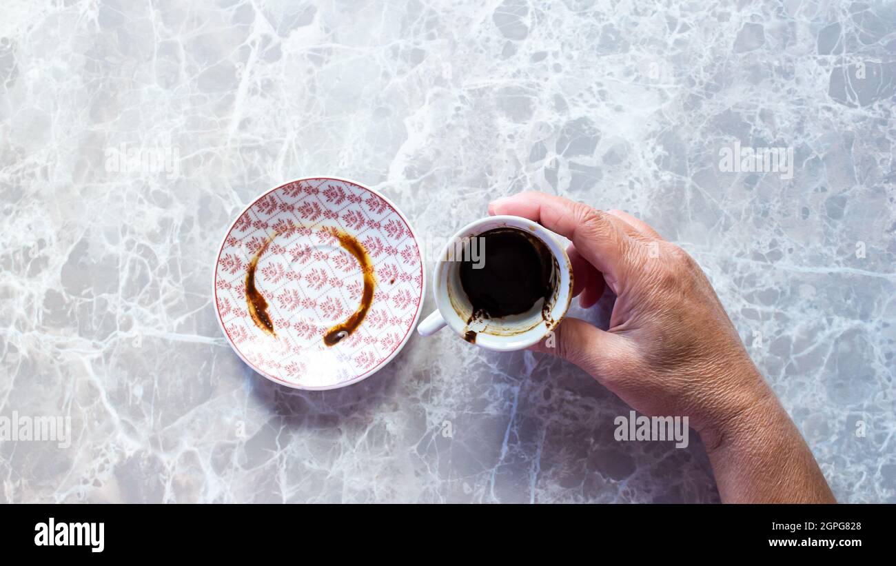 Fortune telling. Woman holding Turkish coffee and fortune telling Stock
