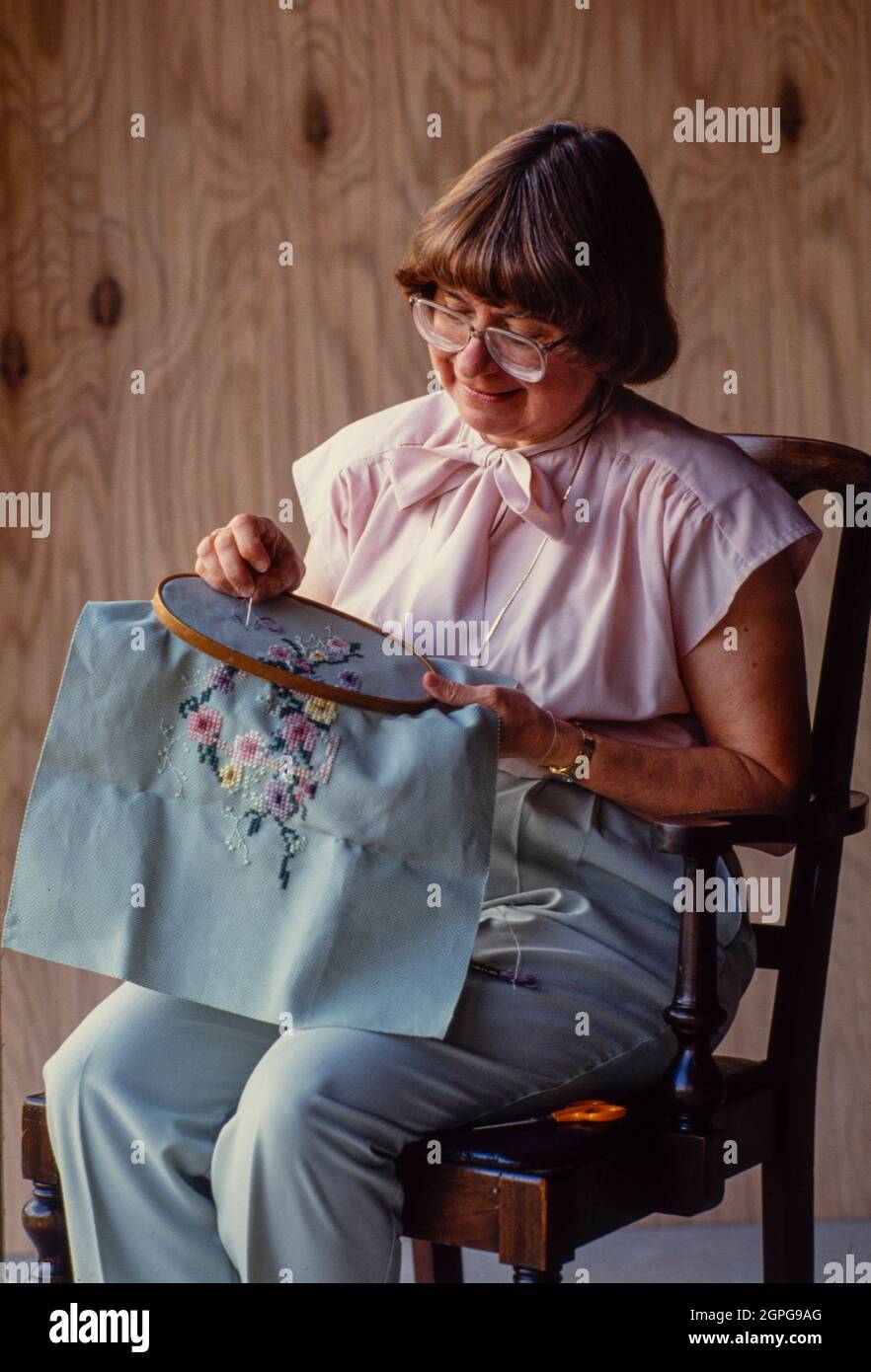 woman sewing embroidery using a hoop Stock Photo