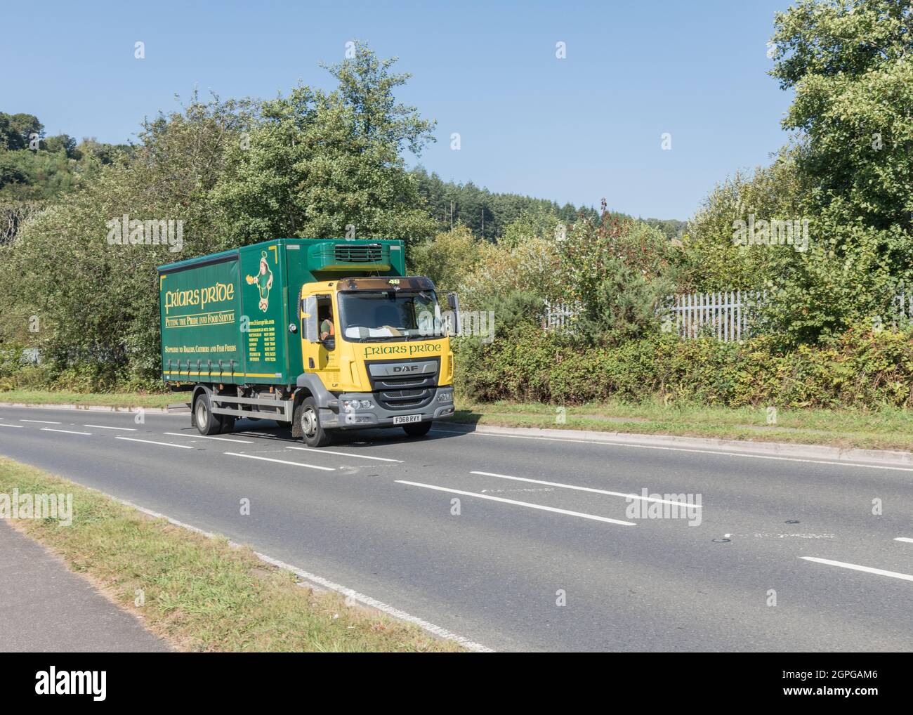 Friar's Pride DAF LF 210 catering delivery truck travelling on uphill country road. For UK driver shortage, goods delivery during Covid, UK transport Stock Photo