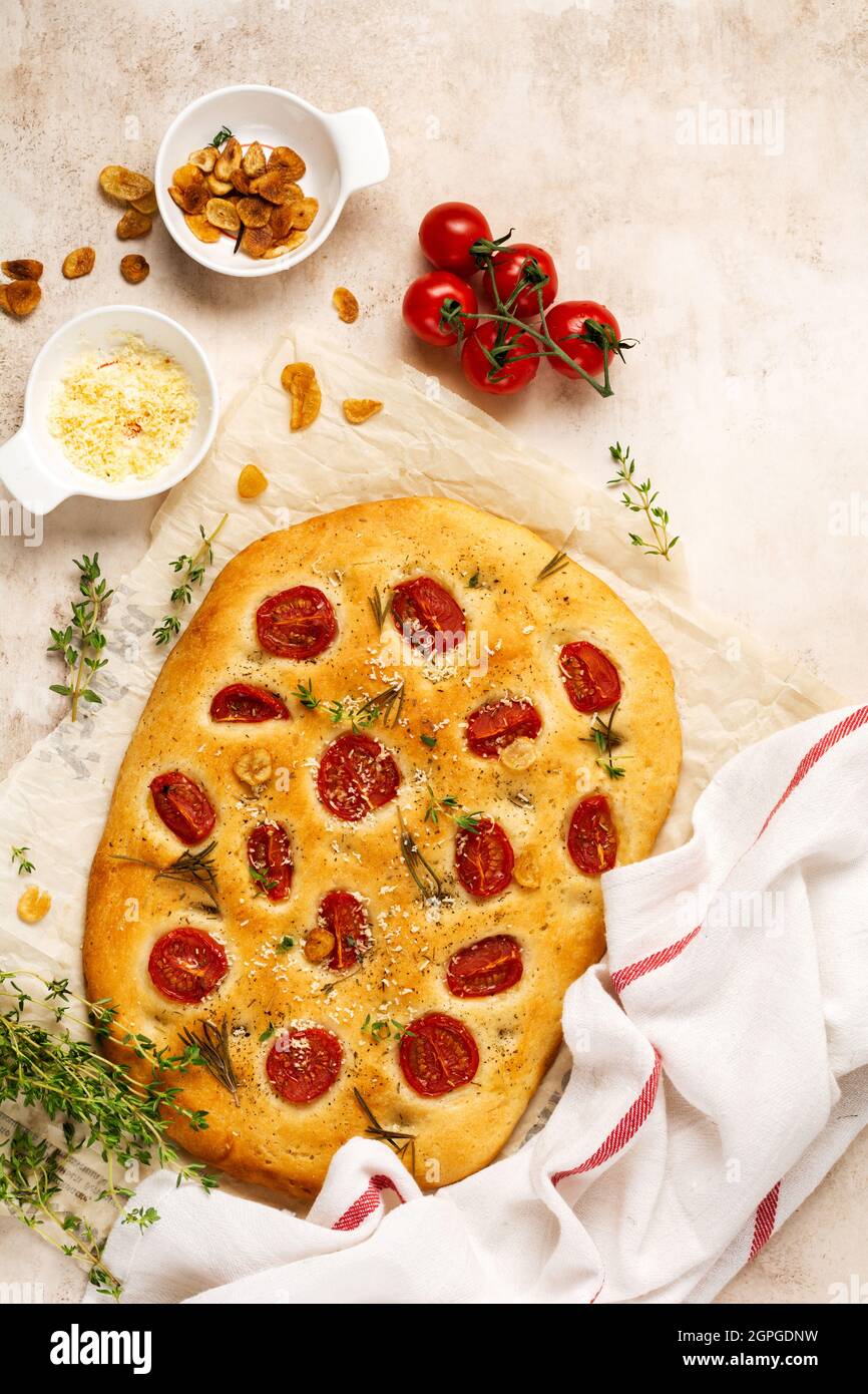Italian traditional focaccia bread baking with with cherry tomatoes ... Italian traditional focaccia bread baking with with cherry tomatoes ...