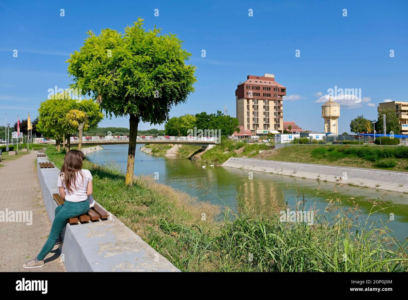 Croatia, Slavonia, Vukovar, the Vuka river which flows into the Danube with the old water tower and the Dunav hotel in the background Stock Photo