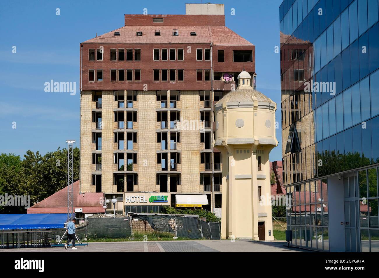Croatia, Slavonia, Vukovar, the Dunav hotel, partly restored and then abandoned and the old water tower Stock Photo