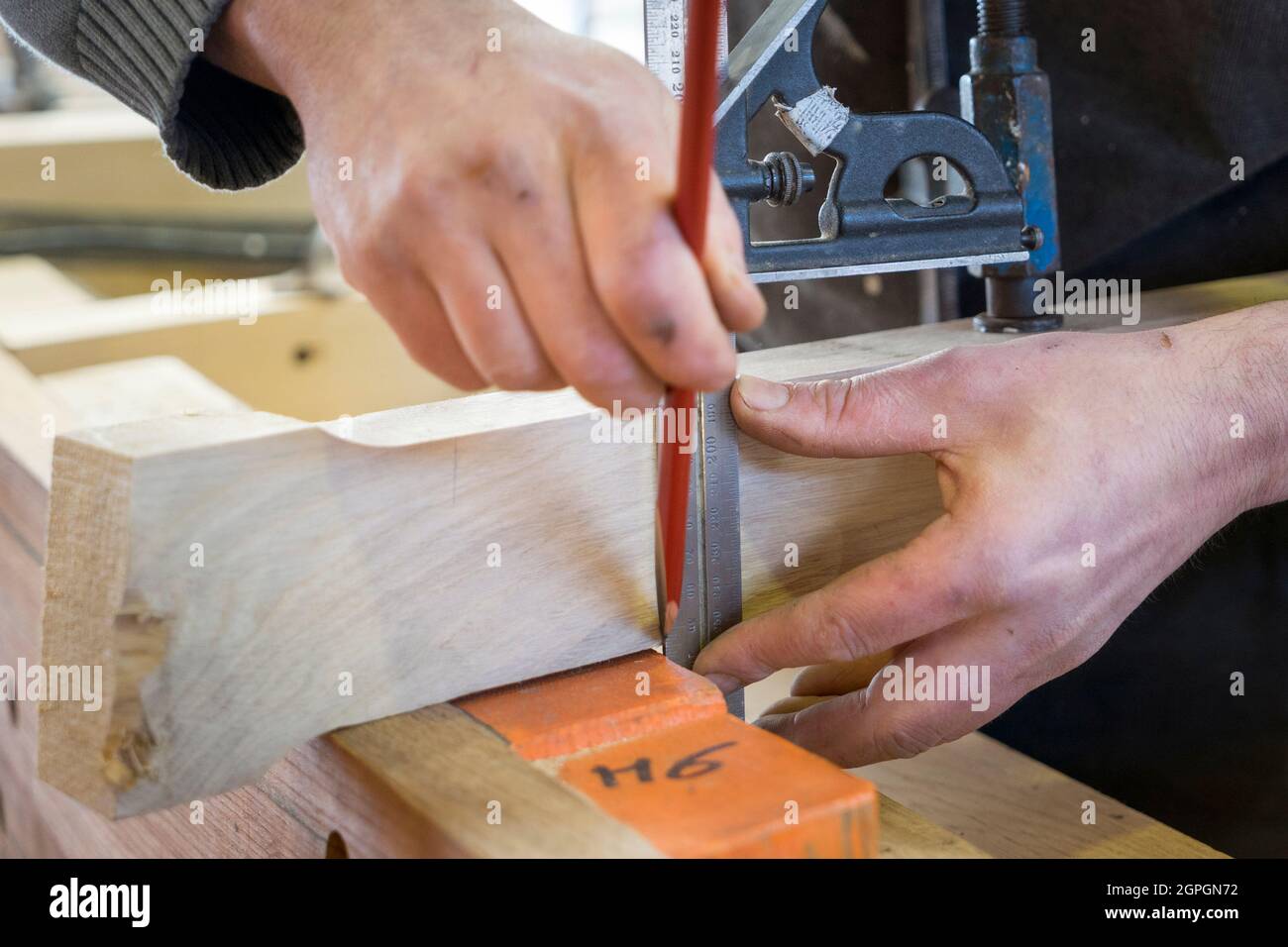 France, Finistere, Brest, Guip Shipyard, a marine carpenter measures a piece of wood Stock Photo