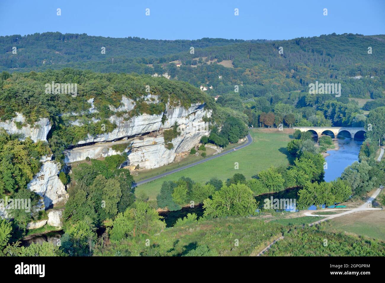 France, Dordogne, Perigord Noir, Vezere Valley, prehistoric site and decorated cave listed as World Heritage by UNESCO, Peyzac le Moustier, La Roque Saint Christophe Cliff, troglodytic site dating of the Prehistory, medieval stack machines reconstitution under the rock shelter (aerial view) Stock Photo