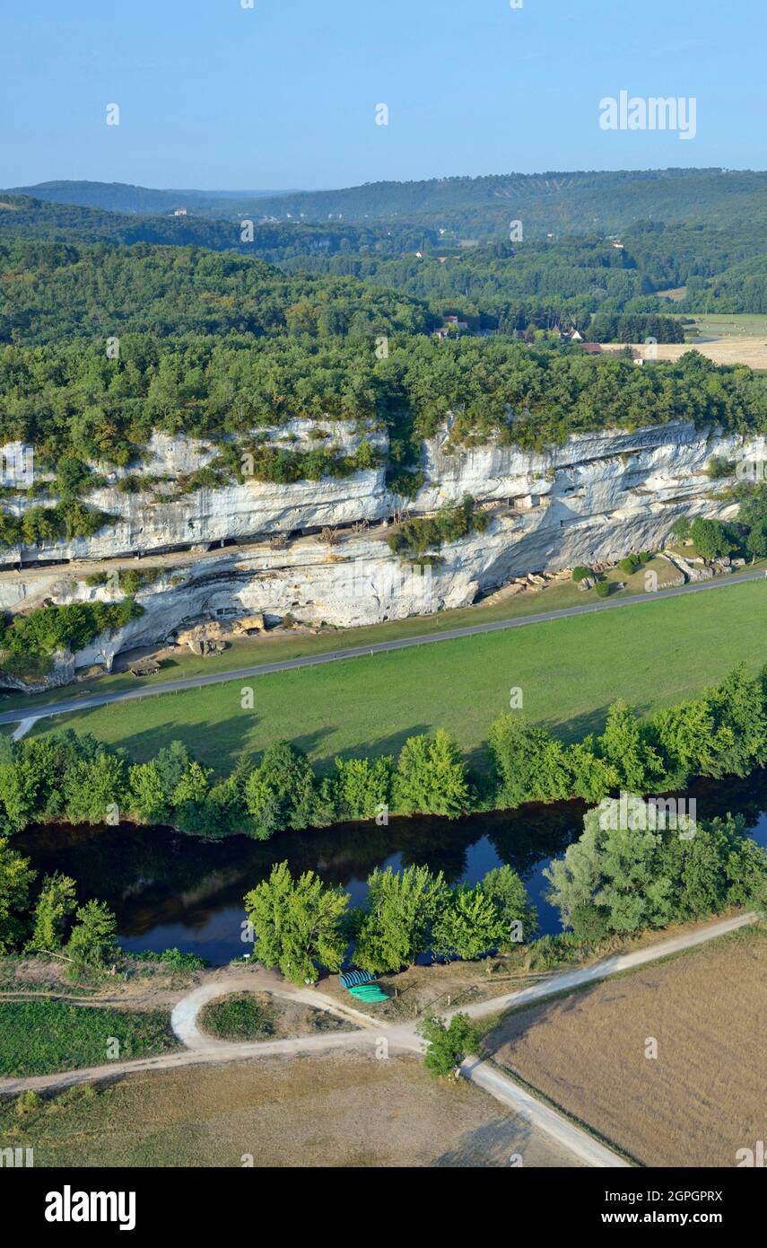 France, Dordogne, Perigord Noir, Vezere Valley, prehistoric site and decorated cave listed as World Heritage by UNESCO, Peyzac le Moustier, La Roque Saint Christophe Cliff, troglodytic site dating of the Prehistory, medieval stack machines reconstitution under the rock shelter (aerial view) Stock Photo