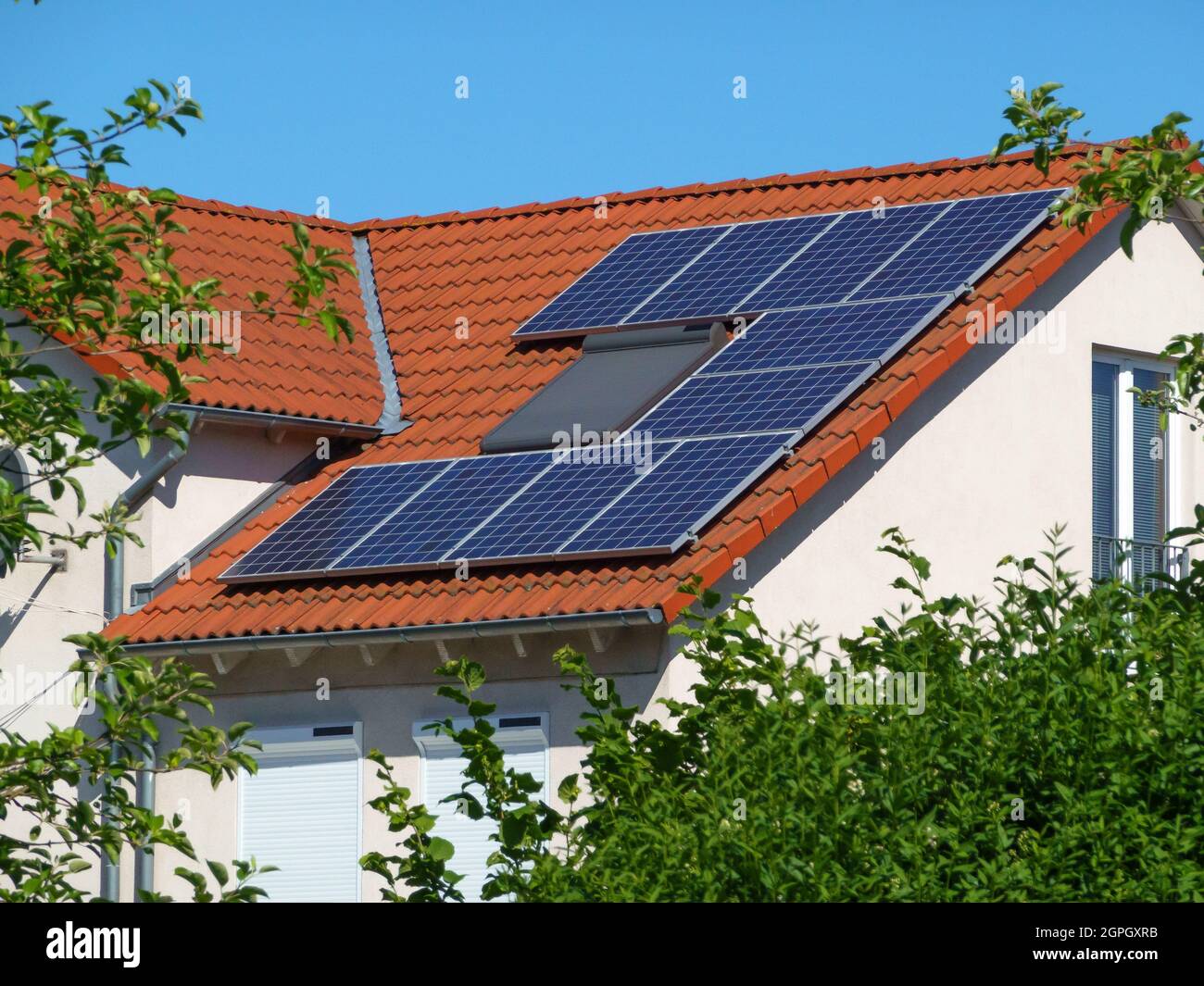solar panels on a roof in the suburbs Stock Photo