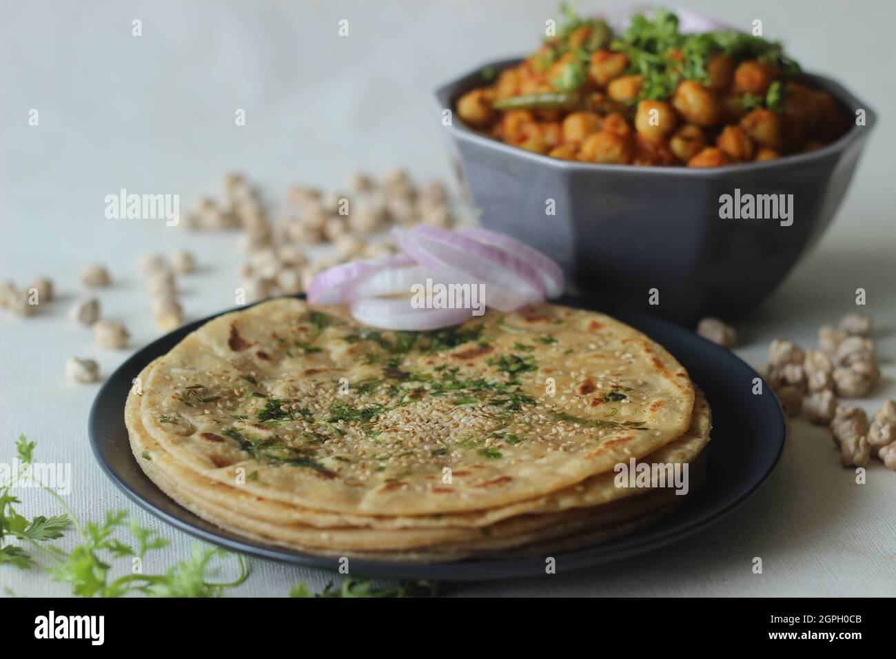 Perfectly round Paratha. Indian flatbread made of wheat flour topped with sesame seeds and