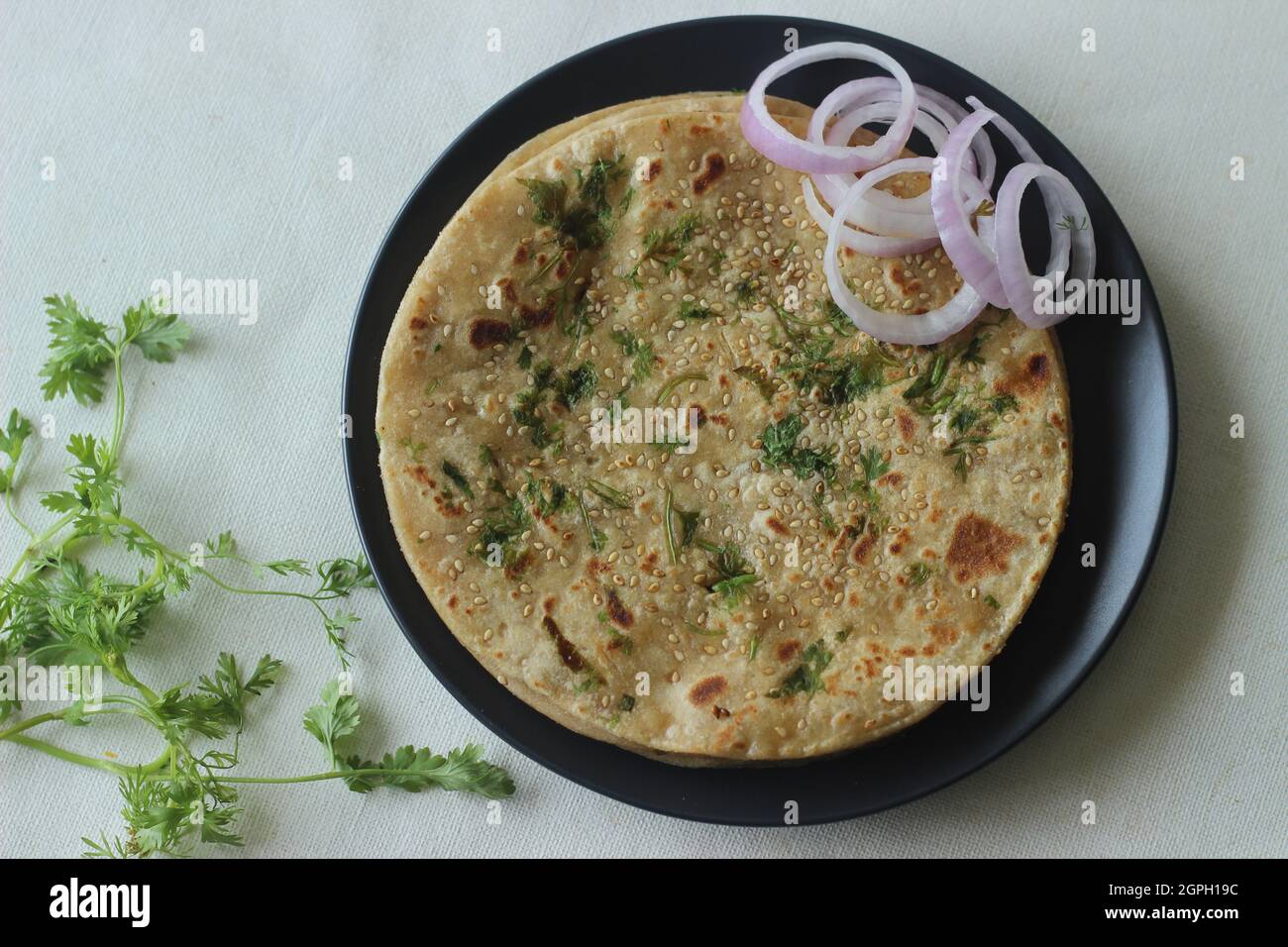 Perfectly round Paratha. Indian flatbread made of wheat flour topped
