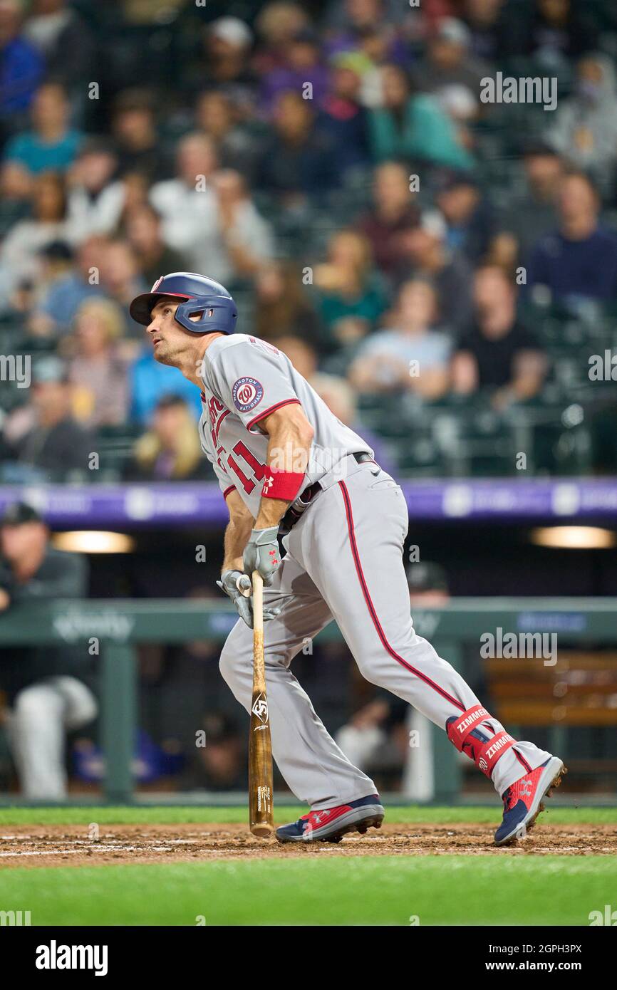 Washington Nationals third baseman Ryan Zimmerman (11) stretches out as he  talks to Atlanta Braves left fielder Justin Upton (R) prior to the first  inning at Turner Field in Atlanta, August 16