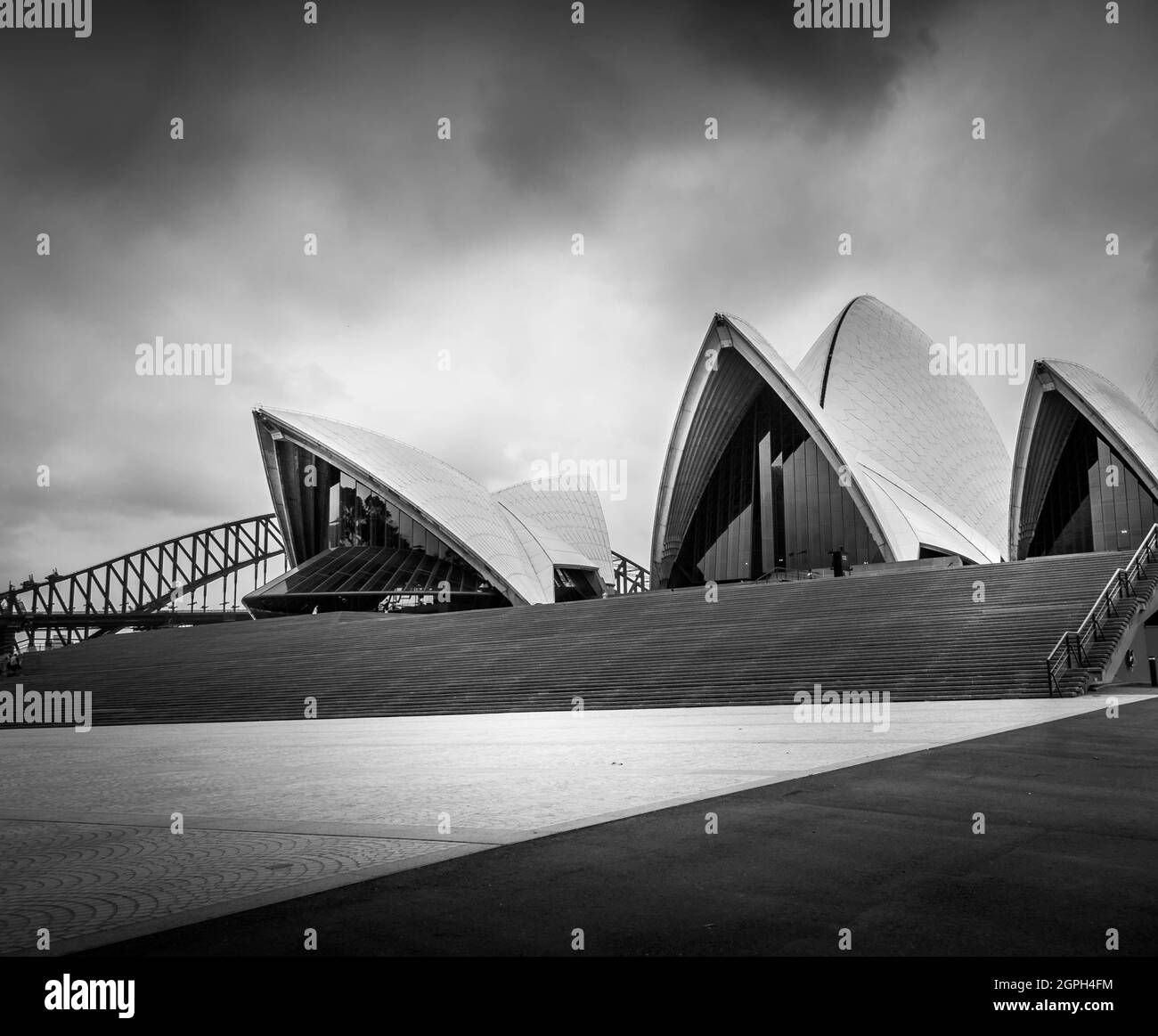 Black and white image of Sydney opera house and bridge with no people. Stock Photo