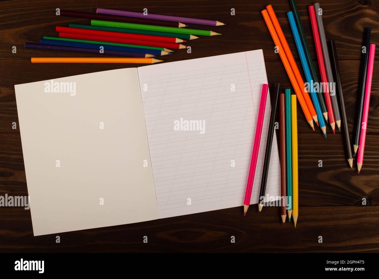 Blank Sketchbook On Wooden Table With Crayons Stock Photo