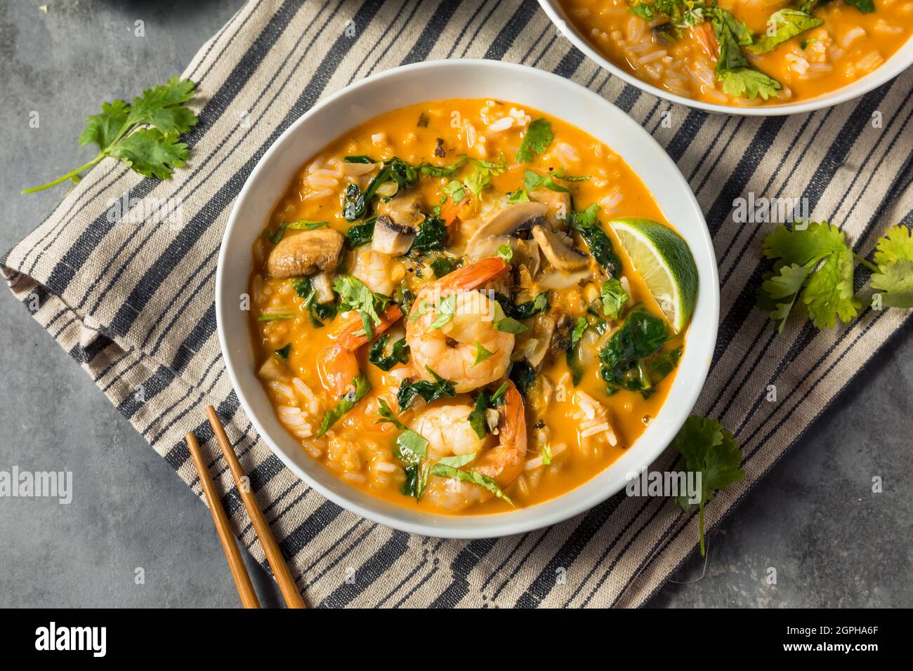 Homemade Spicy Coconut Shrimp Soup with LIme and Cilantro Stock Photo