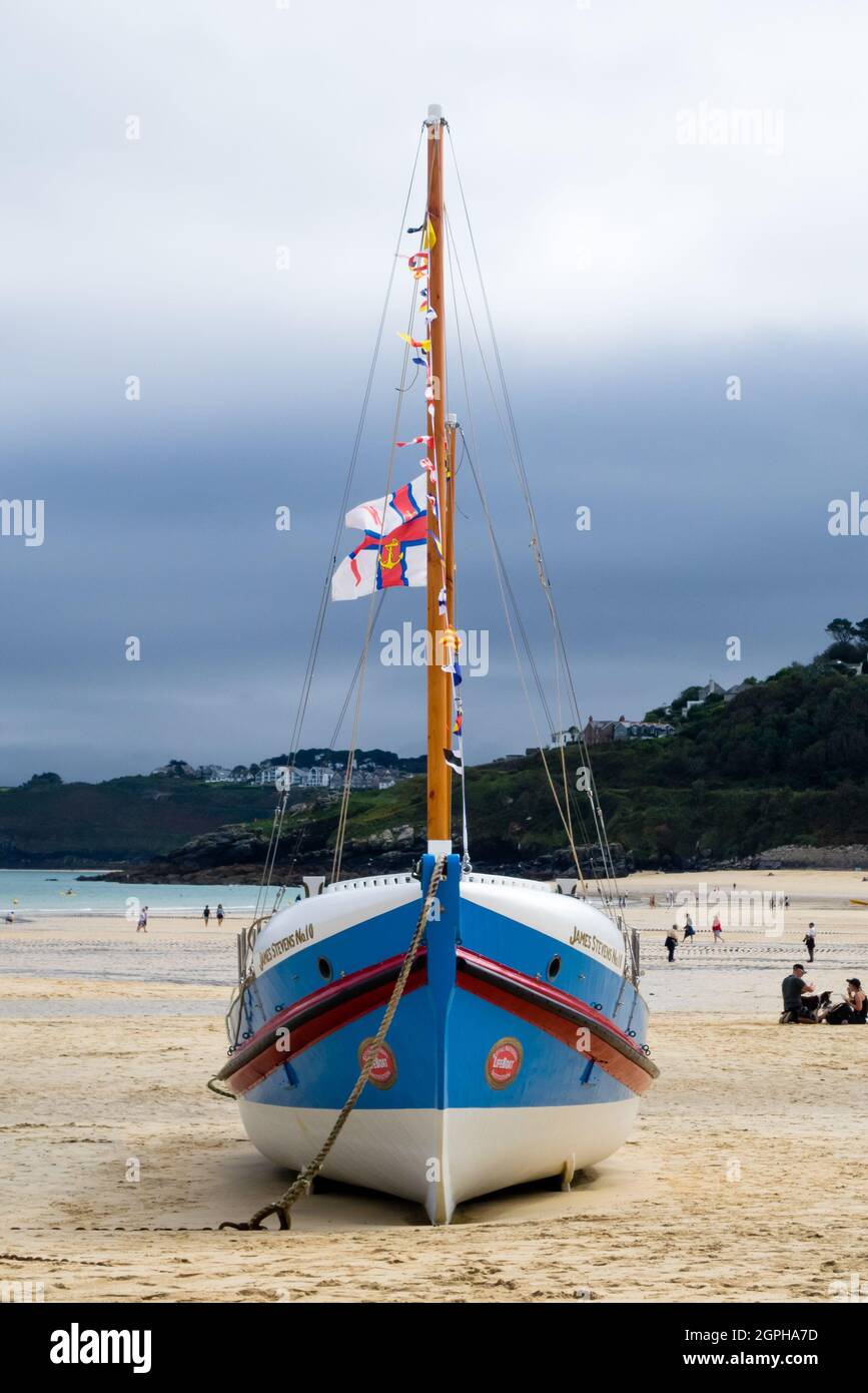 RNLI Lifeboat James Stevens No10  Moored On St. Ives Harbour Beach With Flags Stock Photo