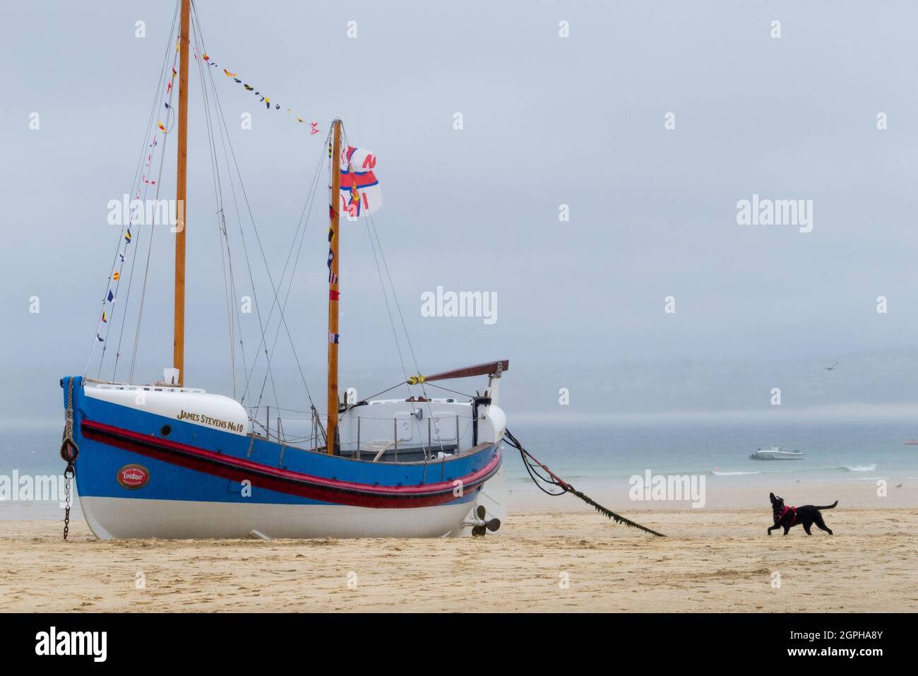 RNLI Lifeboat James Stevens No10  Moored On St. Ives Harbour Beach With Flags Stock Photo