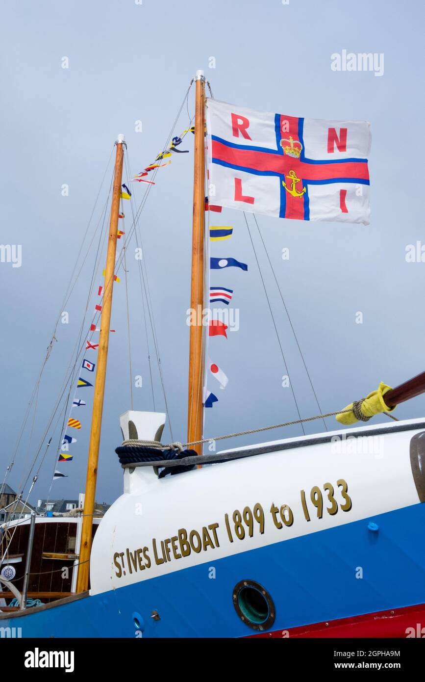 RNLI Lifeboat James Stevens No10  Moored On St. Ives Harbour Beach With Flags Stock Photo
