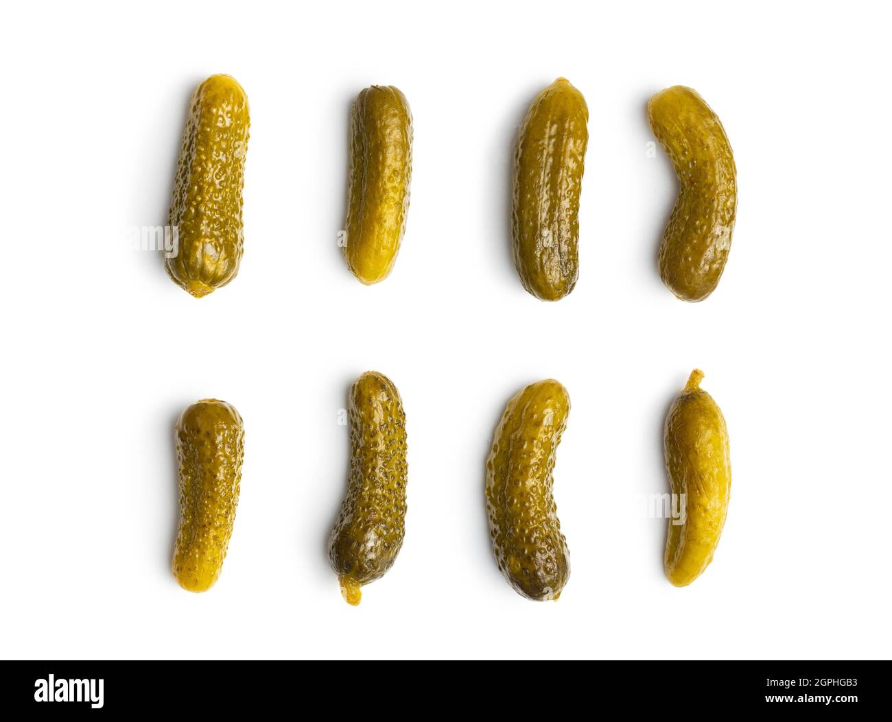 Marinated pickles. Canned cucumbers isolated on white background. Stock Photo