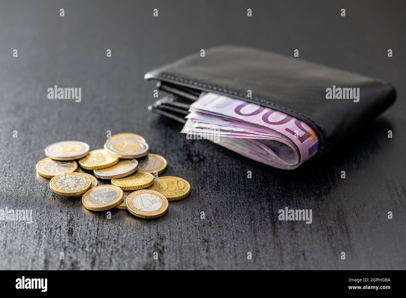 Leather wallet and euro money. Coins and paper banknotes. Stock Photo