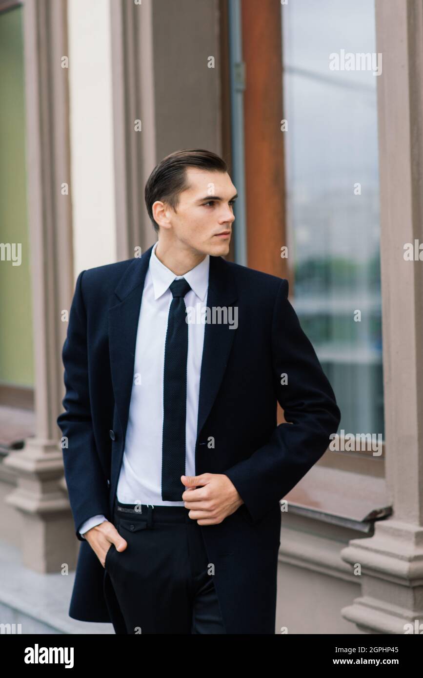 Stylish young businessman in suit on city street hi-res stock ...