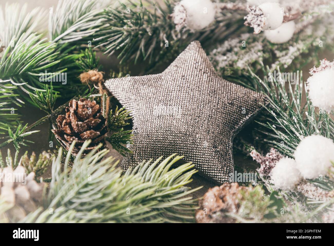 Christmas decoration with fir branches and silver star Stock Photo - Alamy