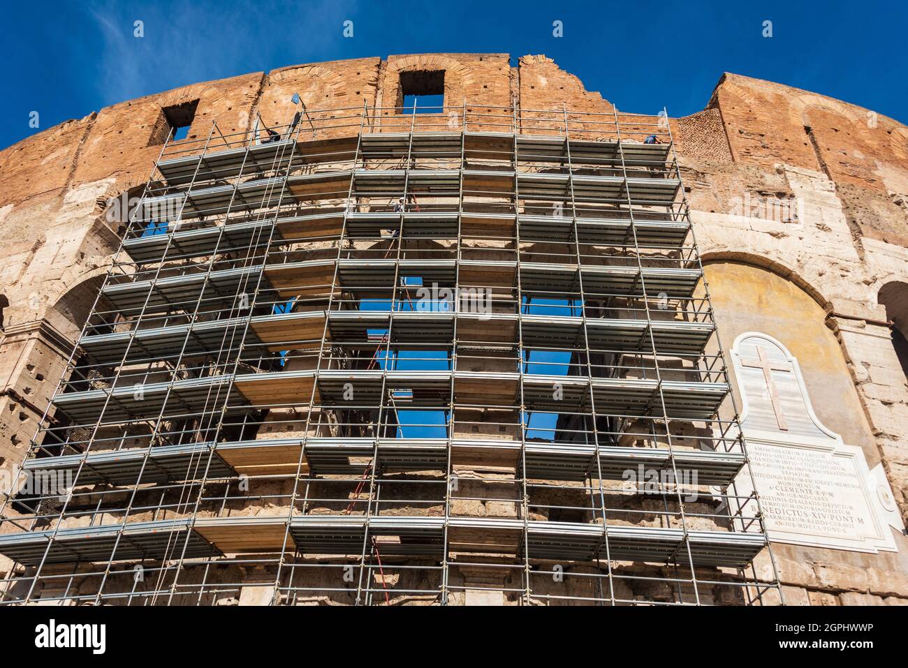 Construction scaffolding around the Colosseum, the iconic symbol of Imperial Rome is also known as the Flavian Amphitheatre. Conservation, renovation Stock Photo