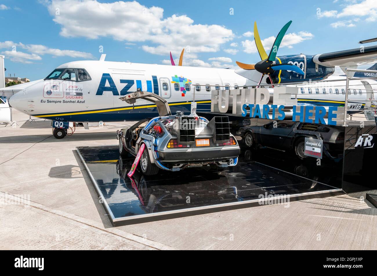 Back to the Future DeLorean car on display alongside Azul ATR-72-600 F-WWEG displayed at Farnborough 2014. Promoting the future Stock Photo