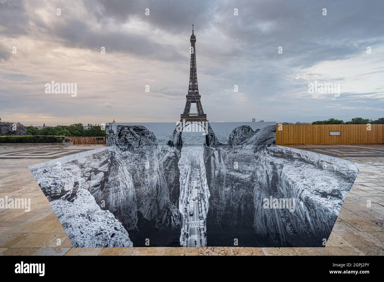 JR anamorphic artwork in front of the Eiffel Tower in Paris Stock Photo