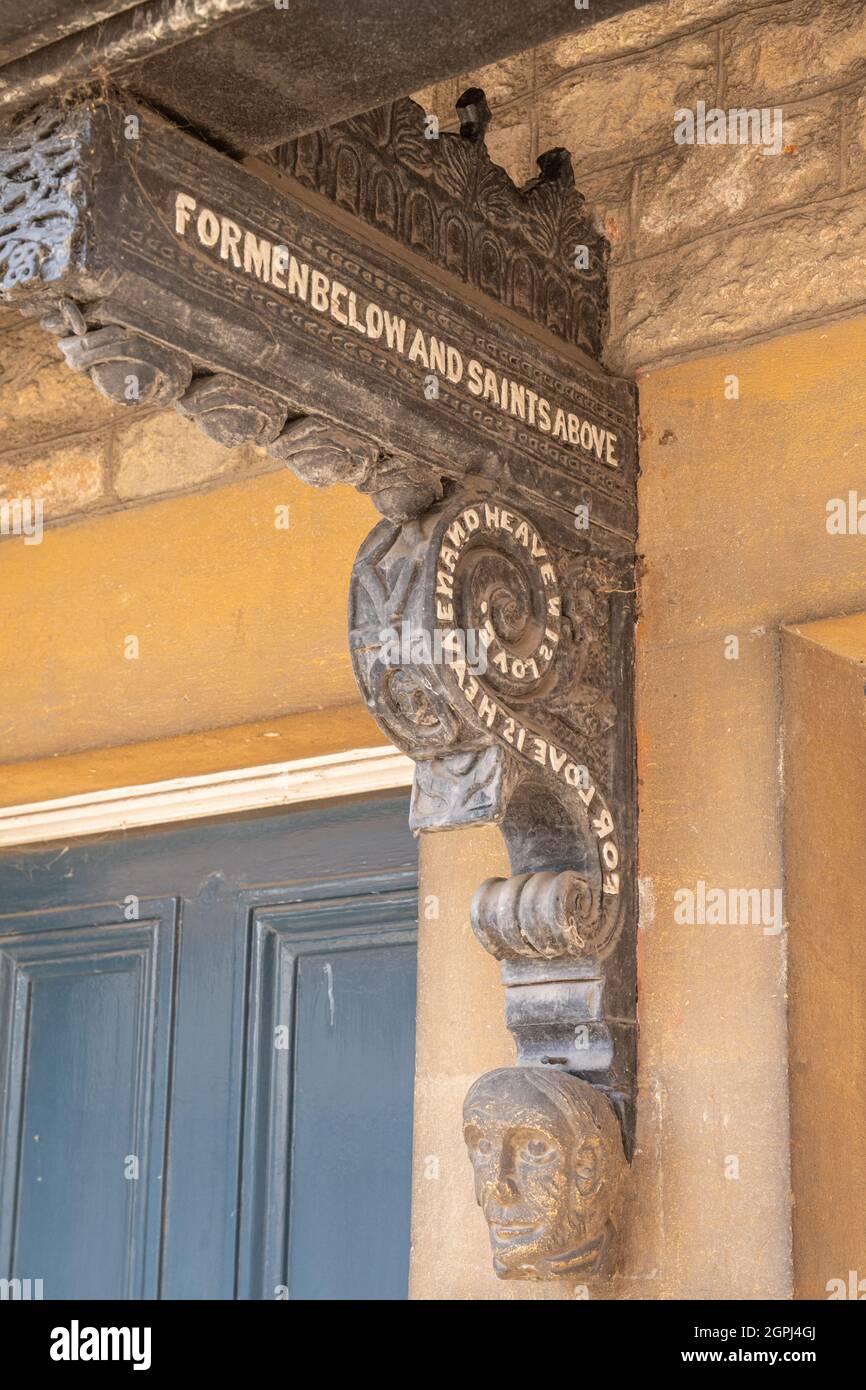 Carved wooden wall bracket on a house in Wells Somerset. Stock Photo