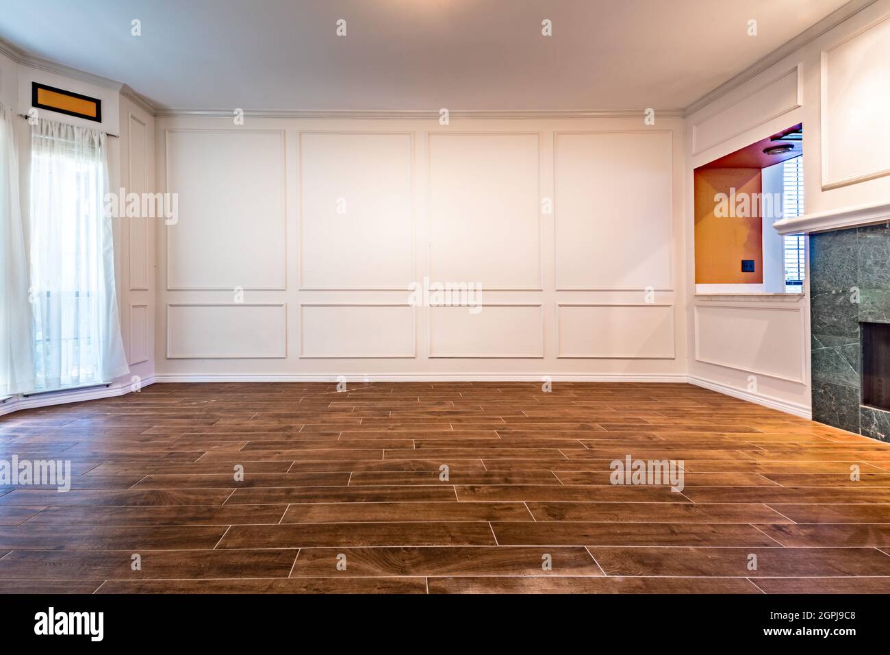Empty living room with hardwood floors Stock Photo