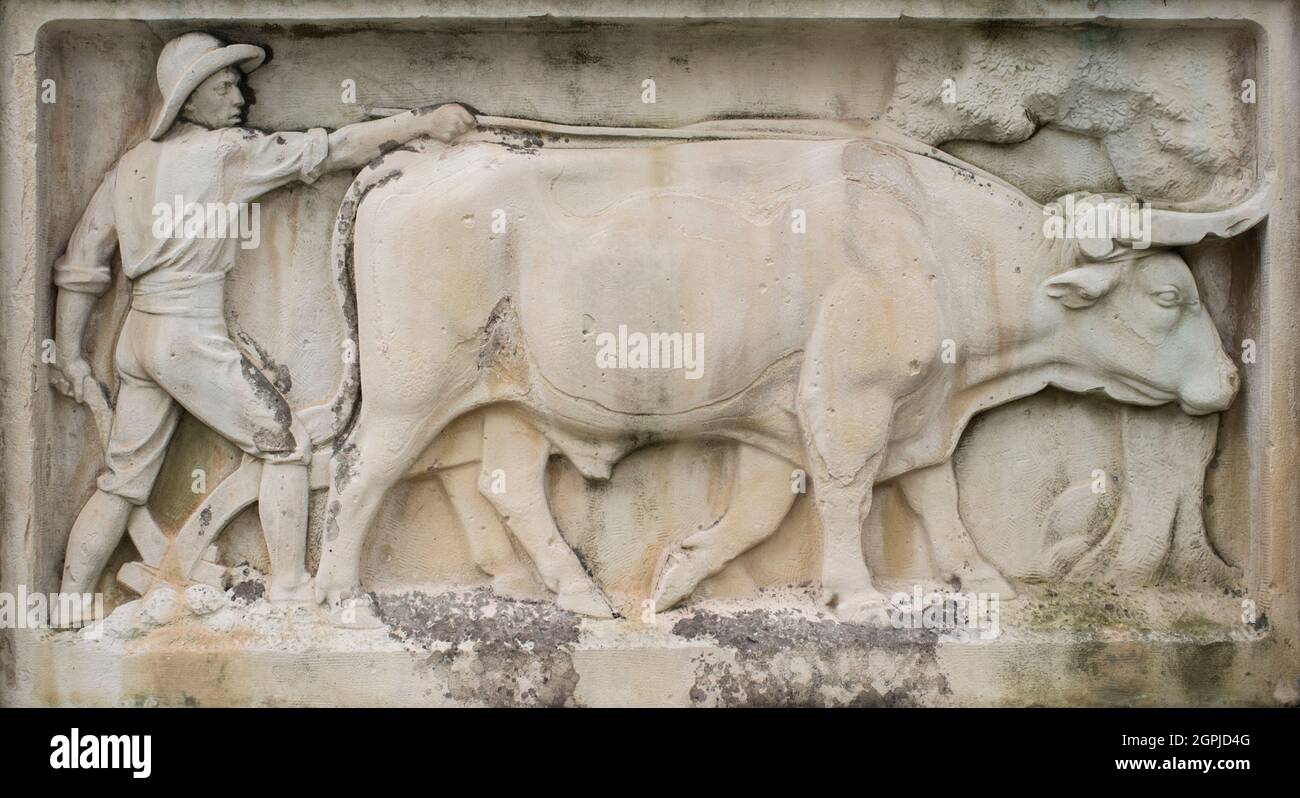 Plough drawn by oxen relief at Gabriel y Galan monument. Sculpted by Perez Comendador in 1926 Stock Photo