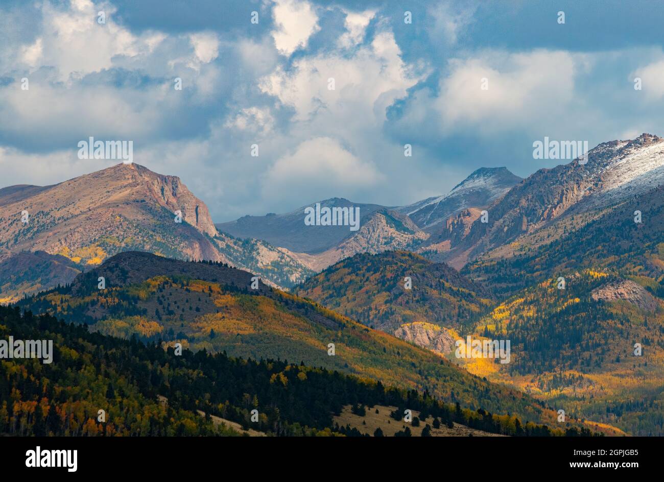 Fresh snow puts a mantle of white on the blazing colors of autumn on Pikes Peak Colorado Stock Photo