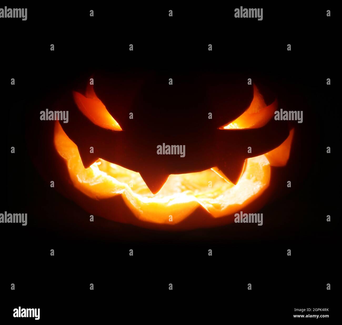 Spooky Halloween jack o lantern face glowing in the dark Stock Photo ...