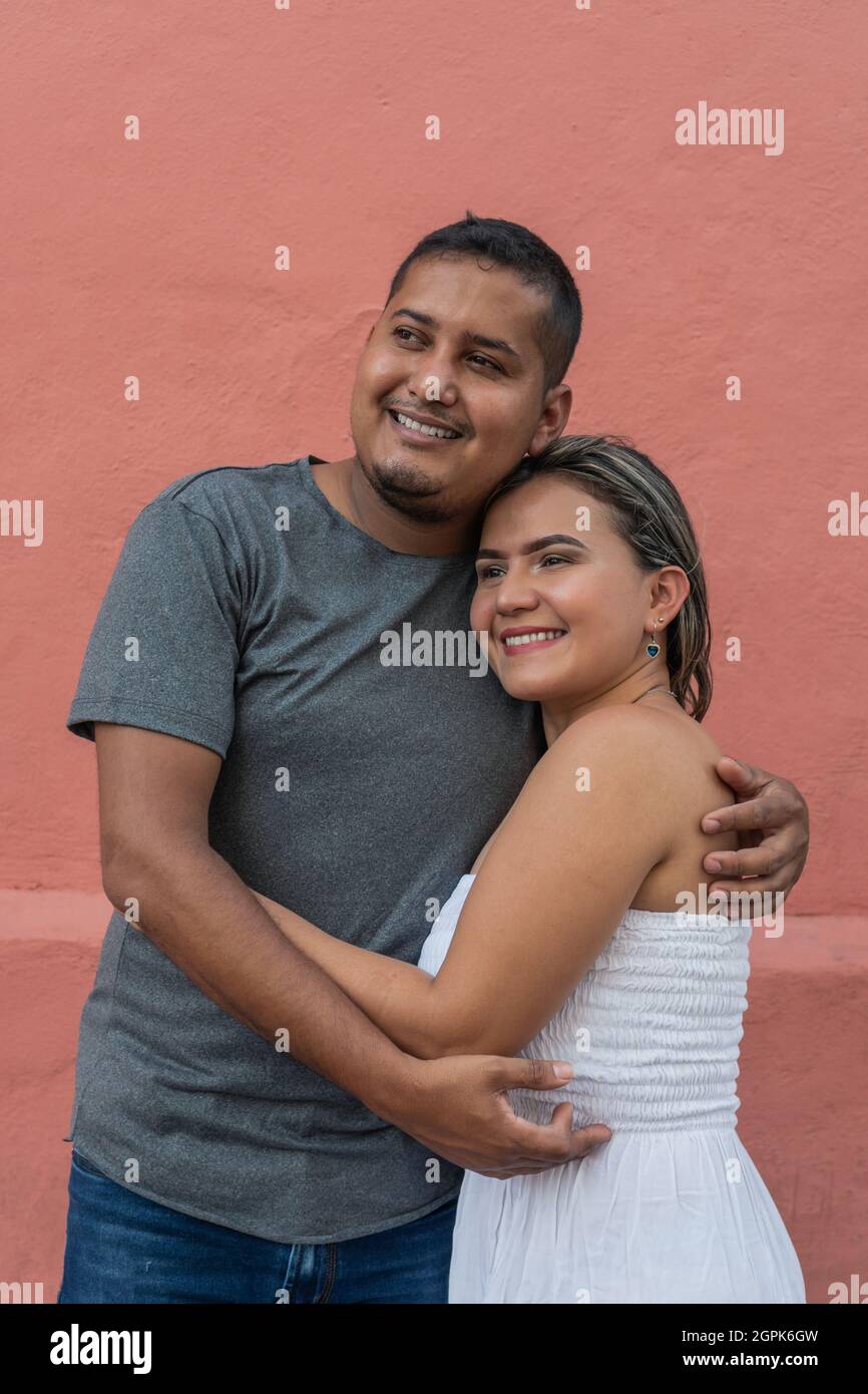 Hispanic couple having fun outside and smiling. Stock Photo