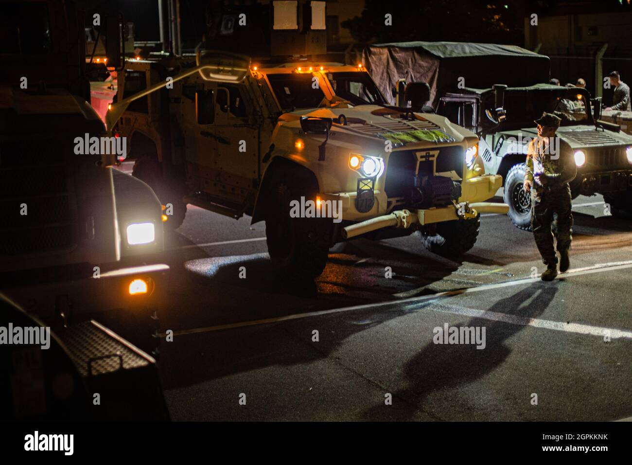 U.S. Marines with 3d Battalion, 12th Marines convoy from Camp Hansen to Naha Port, Okinawa, Japan, during Exercise Noble Jaguar 2021, Sept. 27, 2021. The Marine Corps and Navy leverage integrated command and control and joint sensors to expand battlefield awareness, share targeting data, and conduct long-range precision strikes in support of sea control and sea denial in contested and distributed maritime environments. III Marine Expeditionary Force executed these actions as a part of an integrated operation with 7th Fleet to maintain readiness and demonstrate U.S. resolve to preserve regional Stock Photo