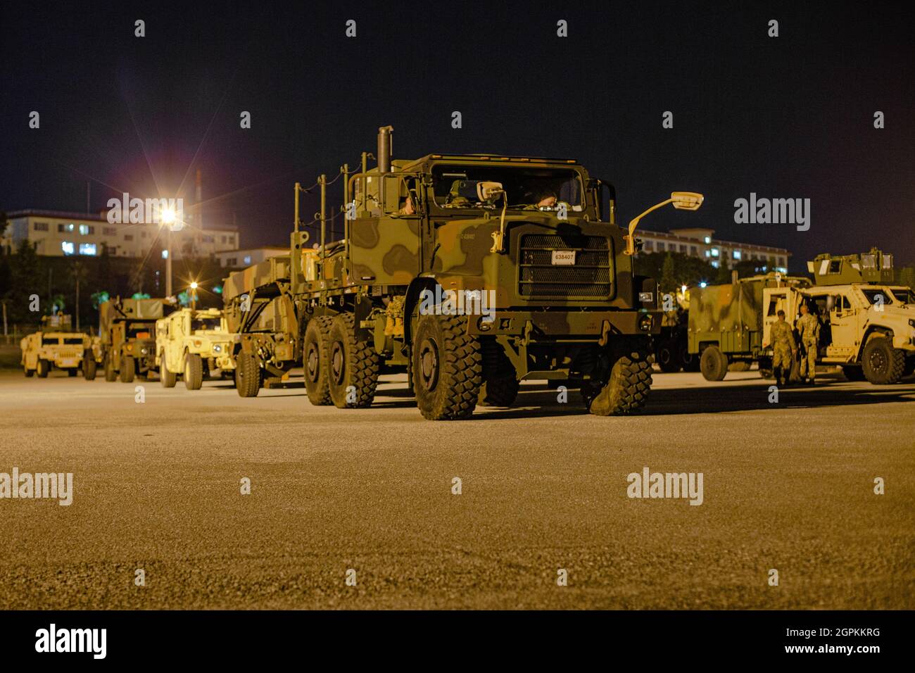 U.S. Marines with 3d Battalion, 12th Marines convoy from Camp Hansen to Naha Port, Okinawa, Japan, during Exercise Noble Jaguar 2021, Sept. 28, 2021. The Marine Corps and Navy leverage integrated command and control and joint sensors to expand battlefield awareness, share targeting data, and conduct long-range precision strikes in support of sea control and sea denial in contested and distributed maritime environments. III Marine Expeditionary Force executed these actions as a part of an integrated operation with 7th Fleet to maintain readiness and demonstrate U.S. resolve to preserve regional Stock Photo