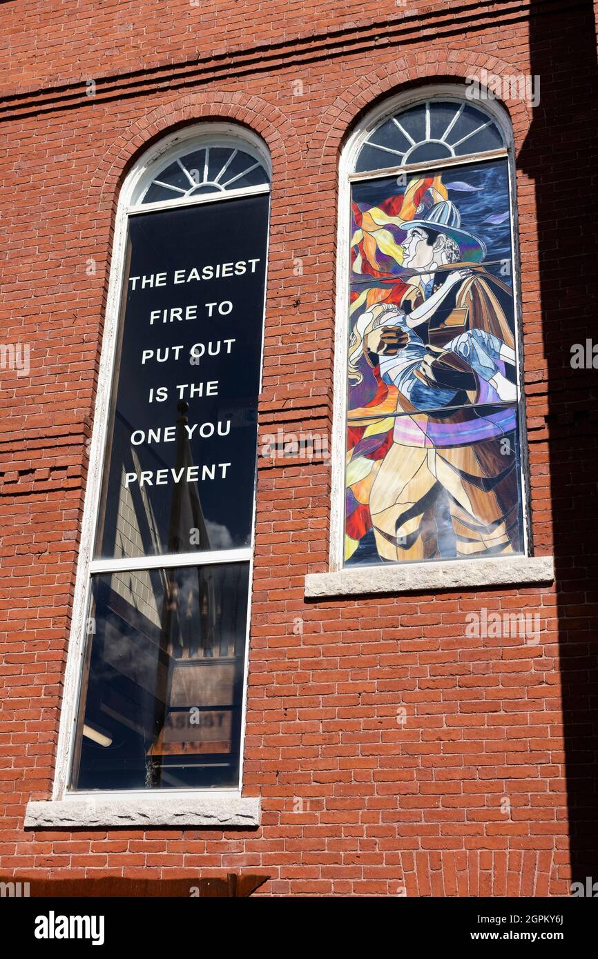 Stained glass window and motto about fire prevention at the fire