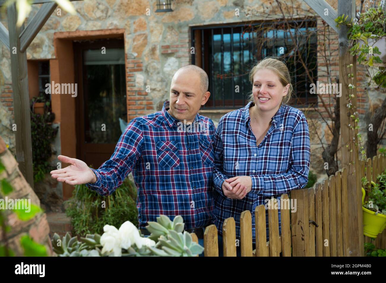 Man and woman standing outdoors Stock Photo