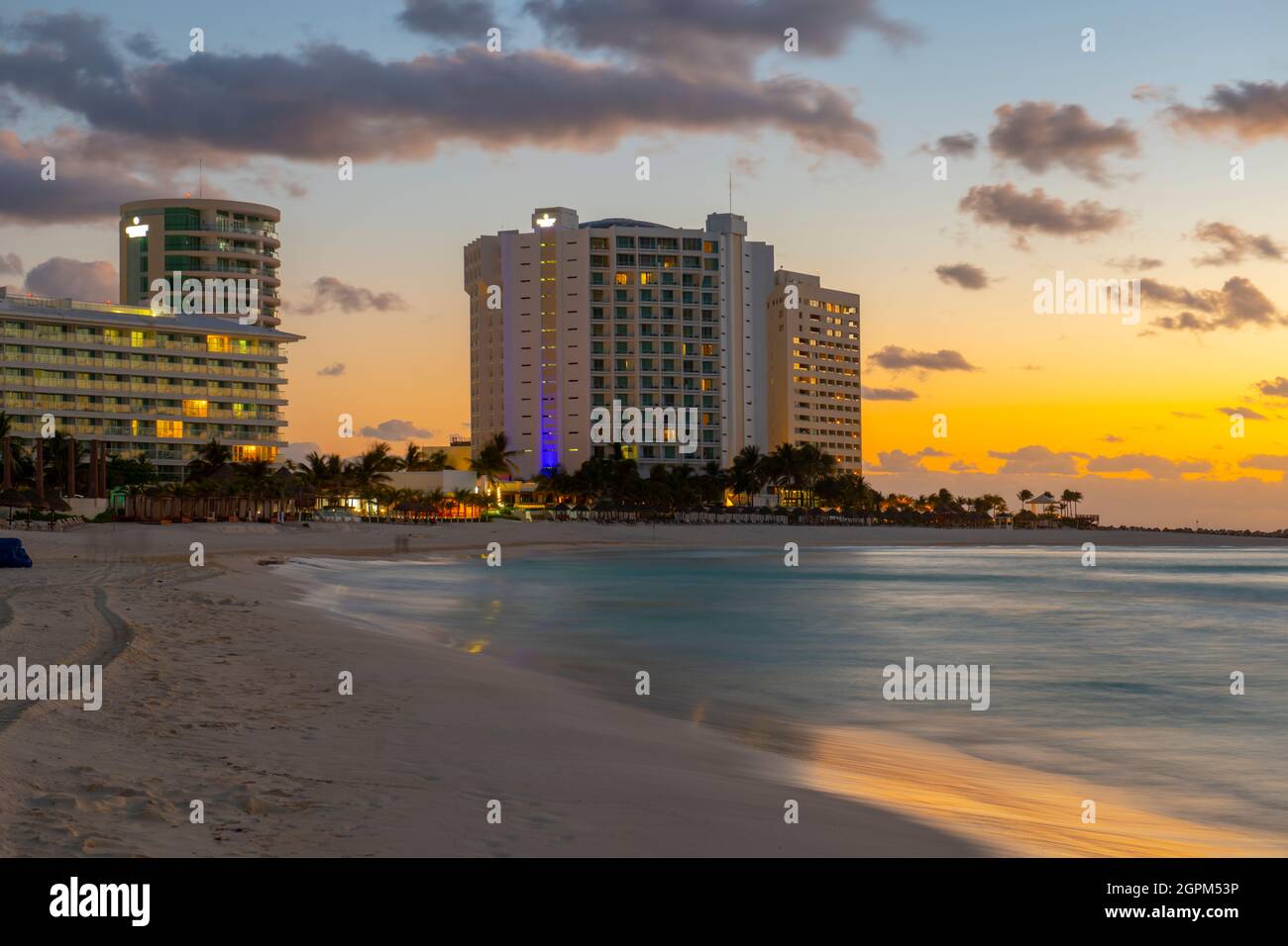Krystal Grand Cancun hotel and Chacmool Beach at sunrise in Cancun, Quintana Roo QR, Mexico. Stock Photo