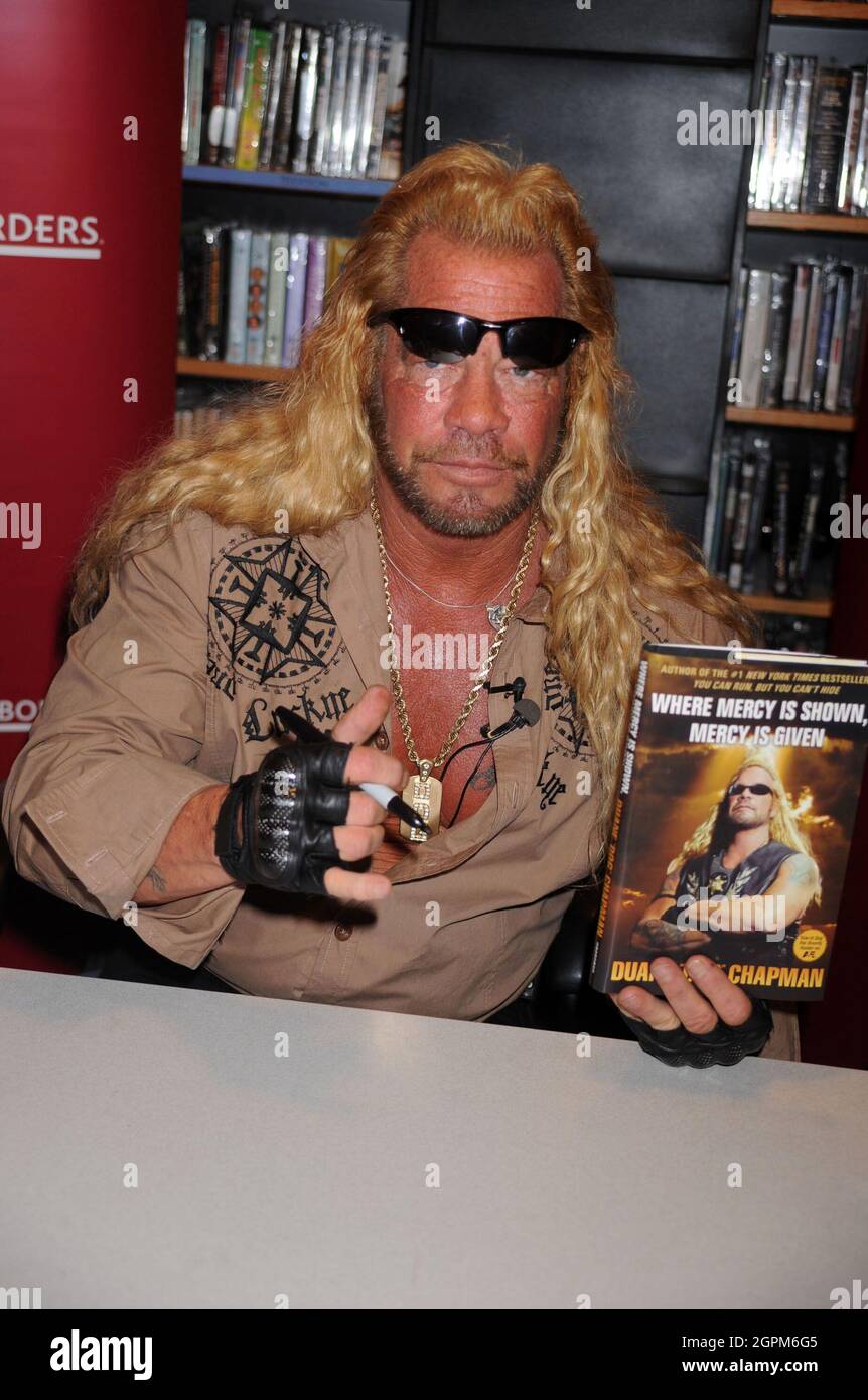 Manchester, United States Of America. 20th Mar, 2010. NEW YORK - MARCH 19: Media personality Duane Chapman (right), known in the media as 'Dog the Bounty Hunter' is joined by his wife Beth Chapman as he promotes his book 'When Mercy Is Shown, Mercy Is Given' at Borders Wall Street on March 19, 2010 in New York City. People: Duane Chapman Credit: Storms Media Group/Alamy Live News Stock Photo