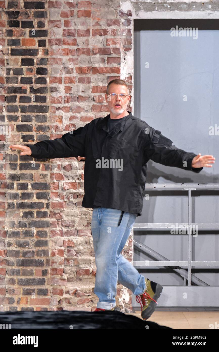 Designer Jonny Johansson acknowledges the audience during the Acne