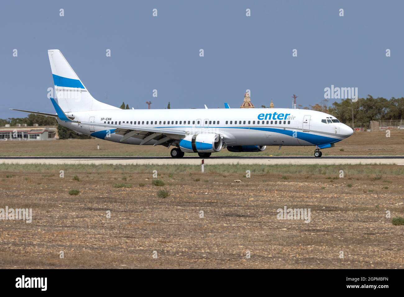 Enter Air Boeing 737-8CX (REG: SP-ENN) arriving runway 13 on a chartered flight. Stock Photo