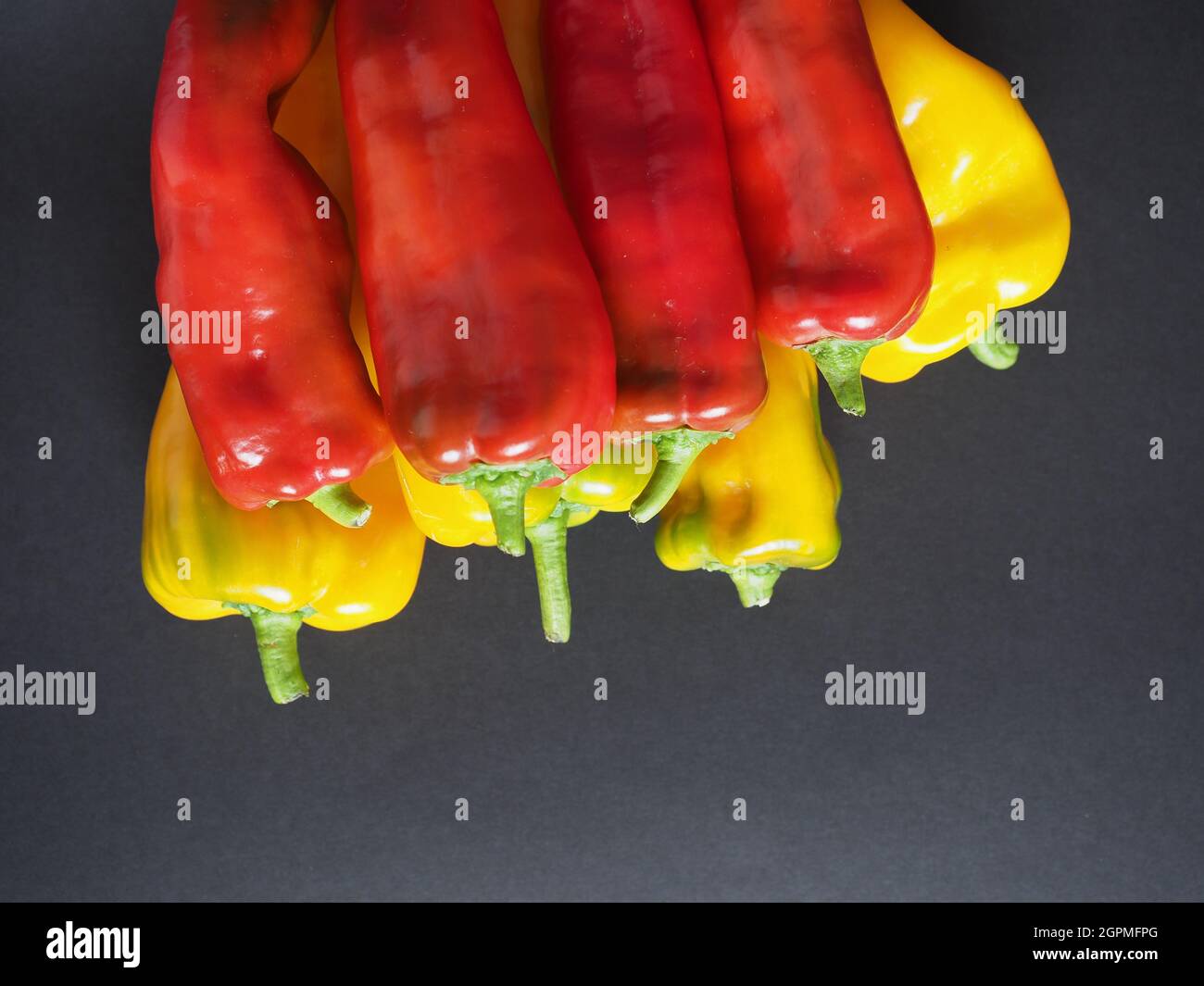 red and yellow peppers (scientific name Capsicum aka bell peppers