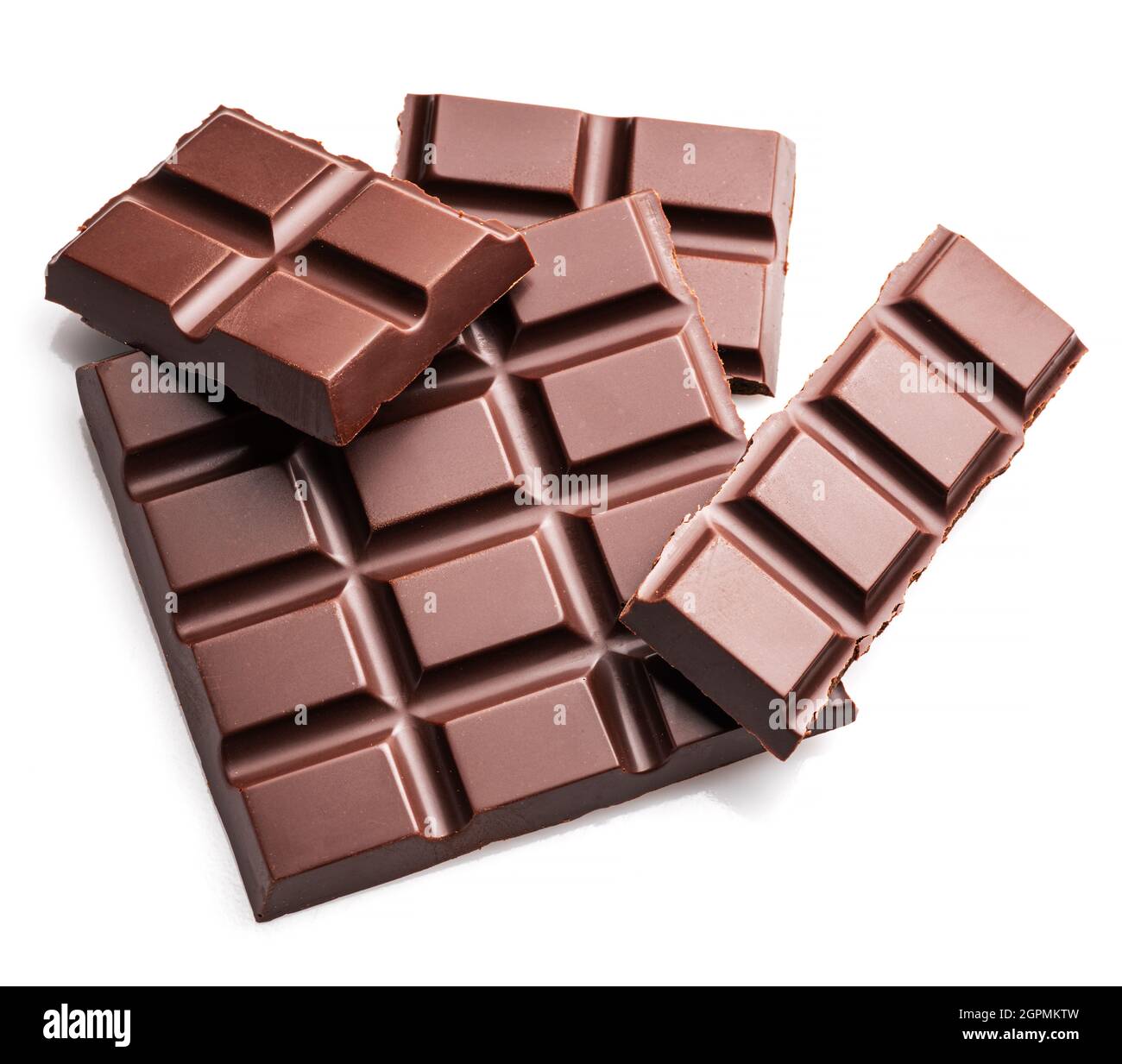 Pieces of dark chocolate bar isolated on white background. Sweet food is made of cocoa and sugar. Stock Photo