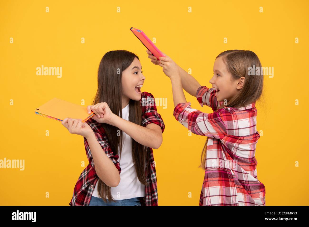 teens ready to study. happy childhood. cheerful kids going to do homework with books. Stock Photo