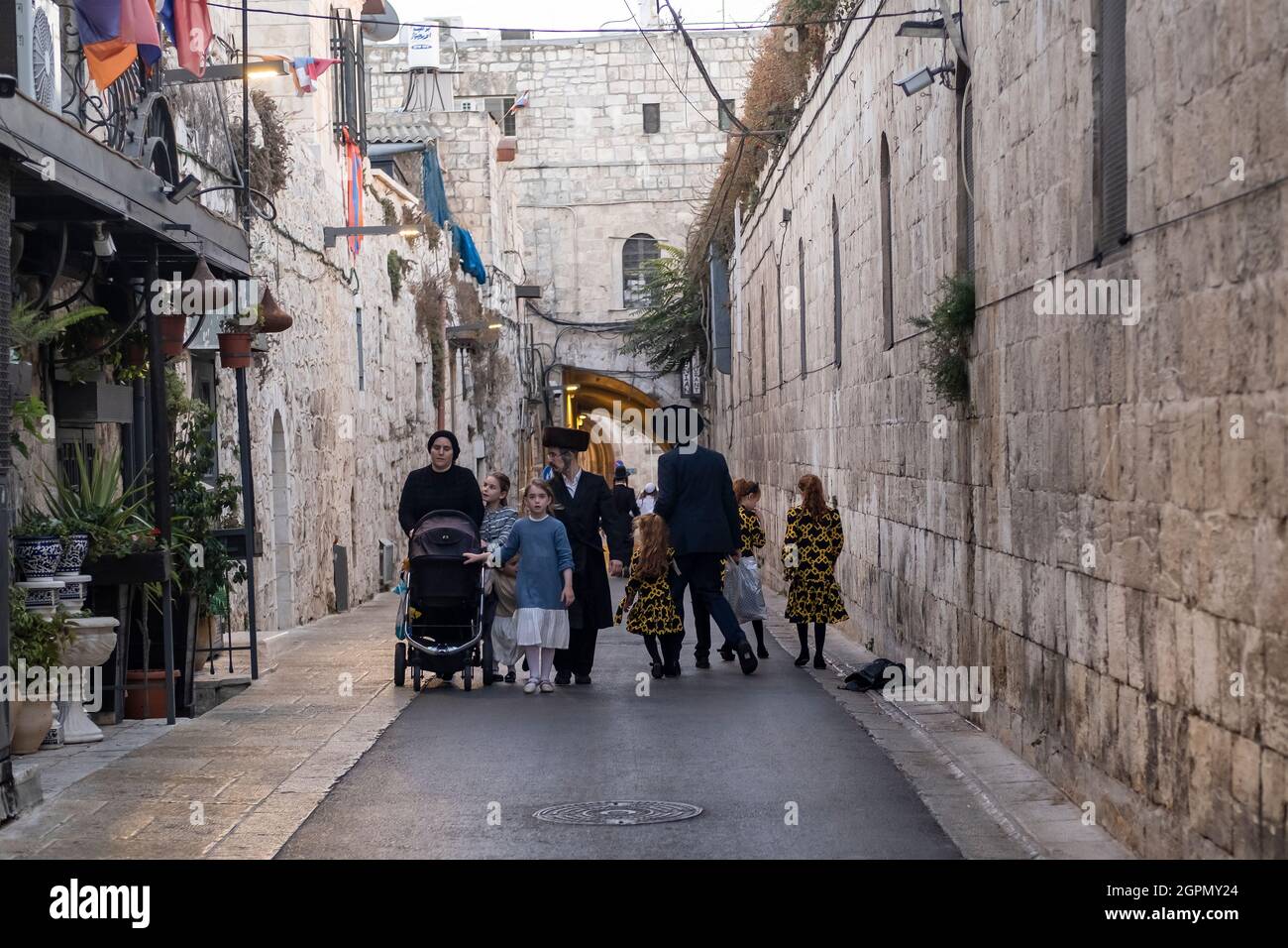 Ultra Orthodox Jews walk on Saturday along the Armenian Patriarchate street in the Armenian quarter in the old city of East Jerusalem Israel Stock Photo