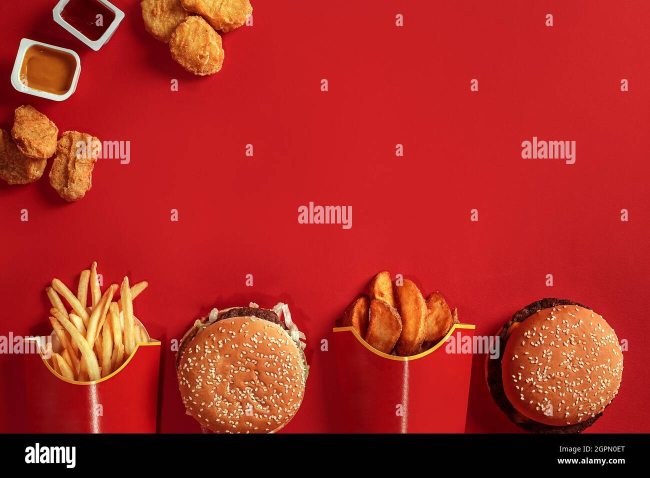 Burger and Chips. Hamburger and french fries in red paper box. Fast