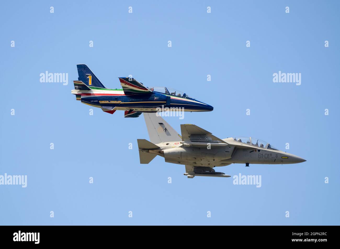 Aermacchi M 345 advanced military jet trainer plane in Frecce Tricolori display team colours as number 1, with Alenia Aermacchi M 346 Master. Scale Stock Photo