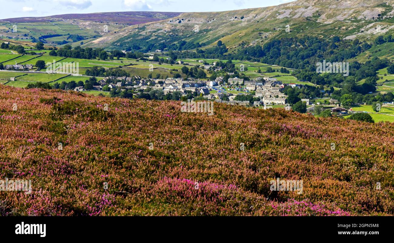Reeth Panoramic view of the village of Reeth, from Grinton moor with heather ...